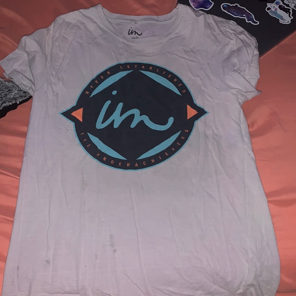 A little stained. Fits like a medium.
